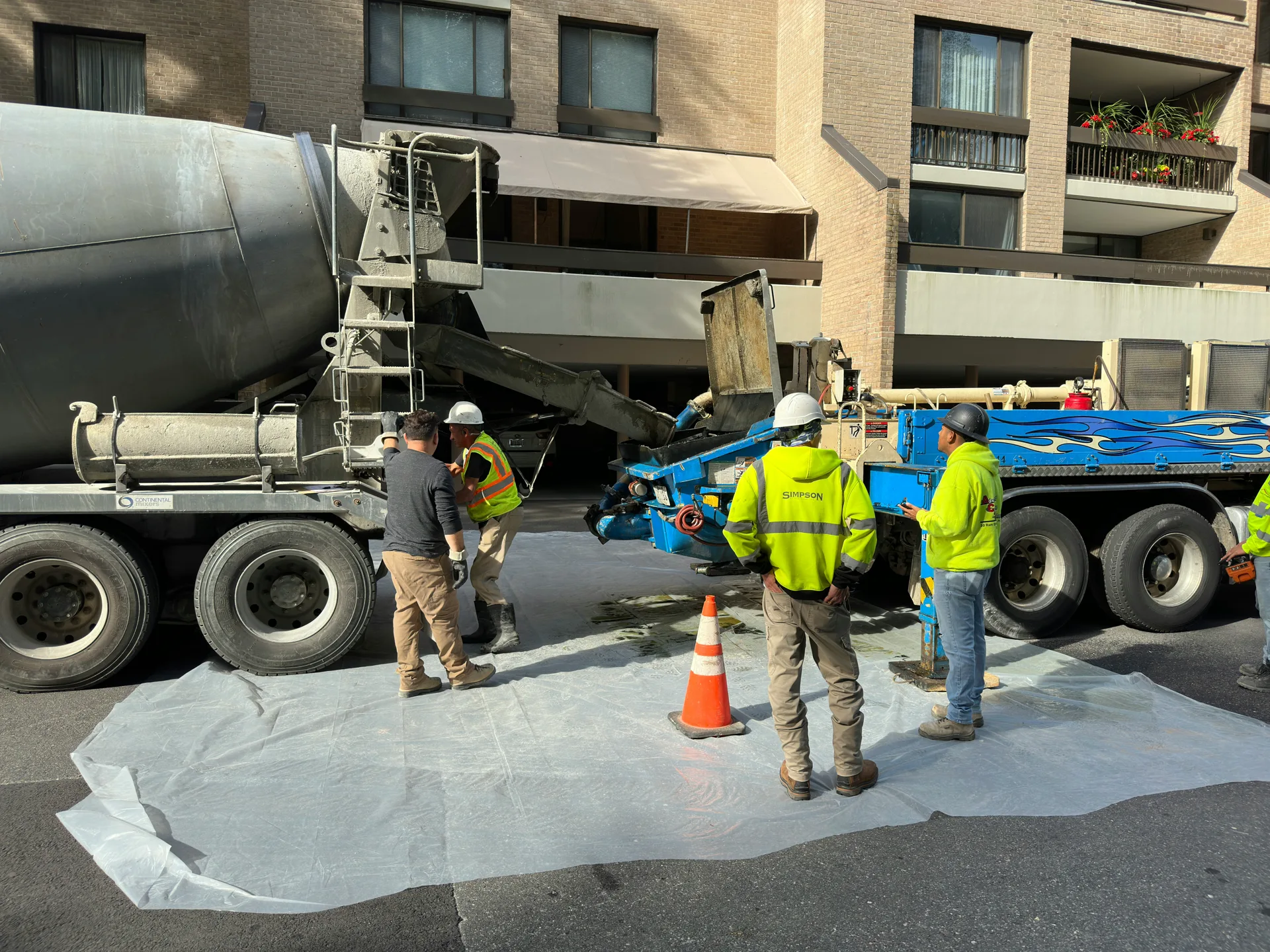 self-leveling concrete being poured over an existing slab in Laval
