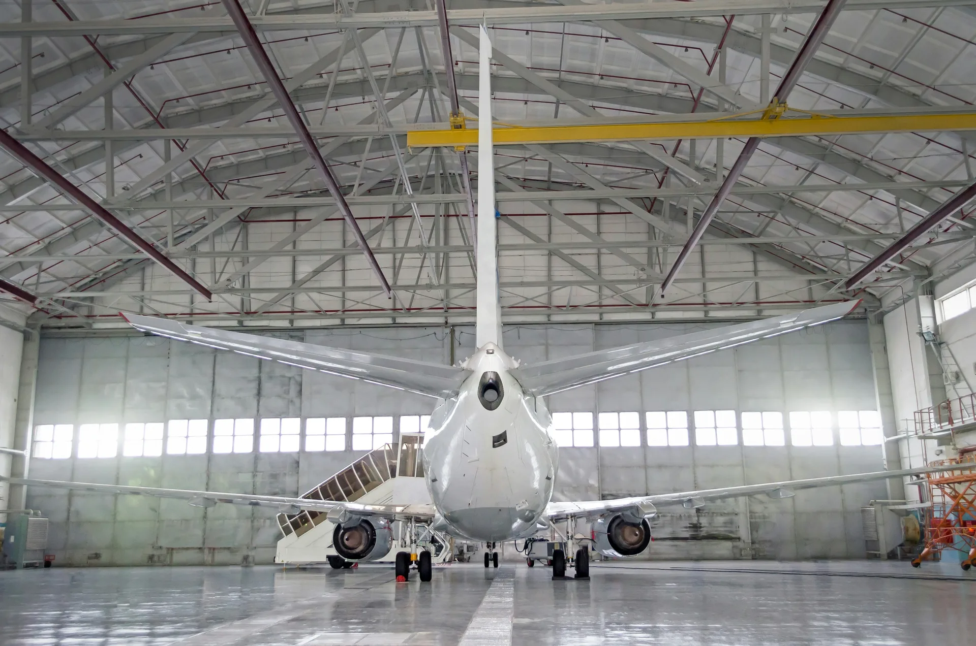 commercial jet on a finished concrete hangar floor in Laval