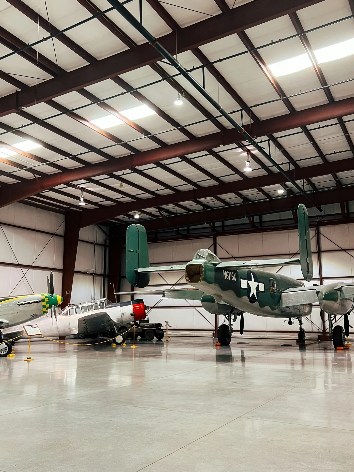 high-gloss concrete hangar floor with a vintage aircraft in Laval