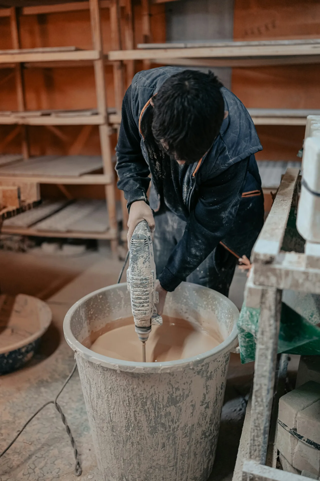 Quikrete bagged concrete being mixed in a paddle mixer on a Laval site
