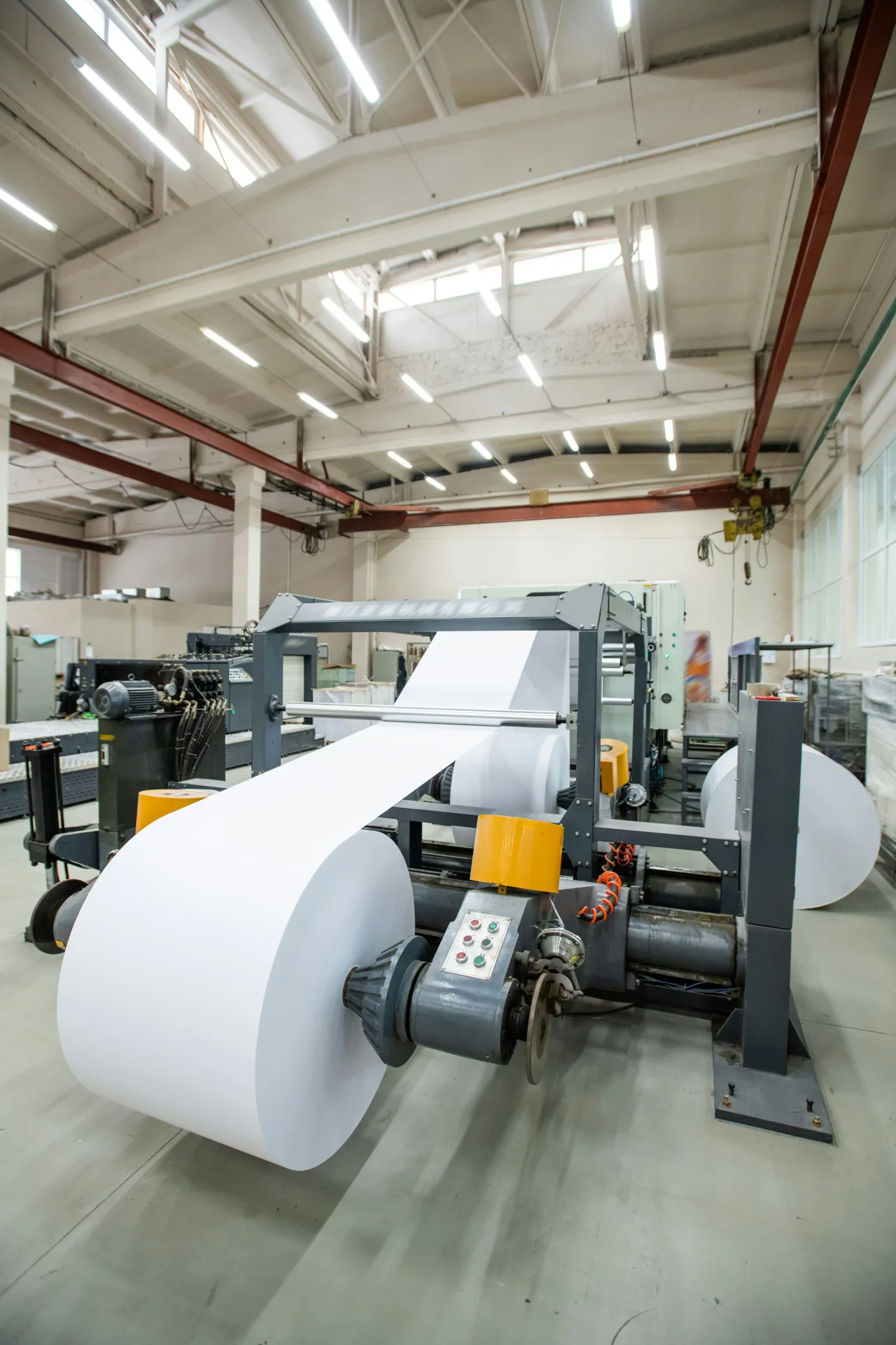 industrial concrete floor under a Laval printing press
