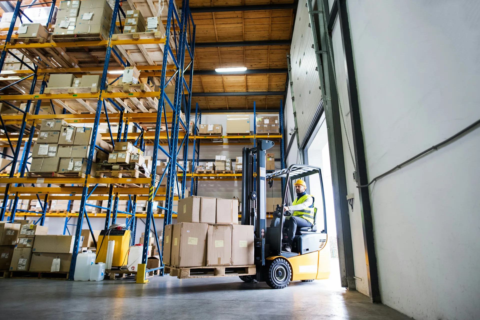 forklift on a finished industrial warehouse floor in a Laval facility