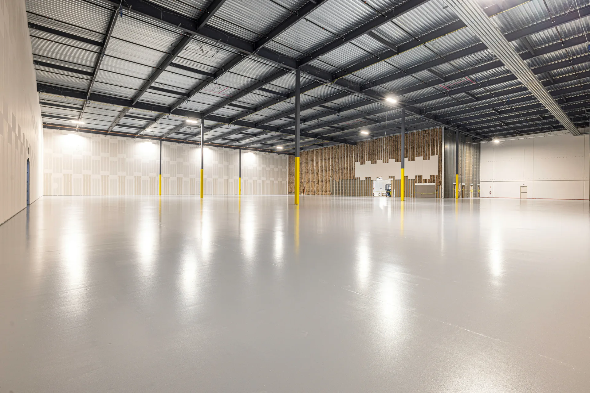 finished grey epoxy warehouse floor in a Laval distribution centre