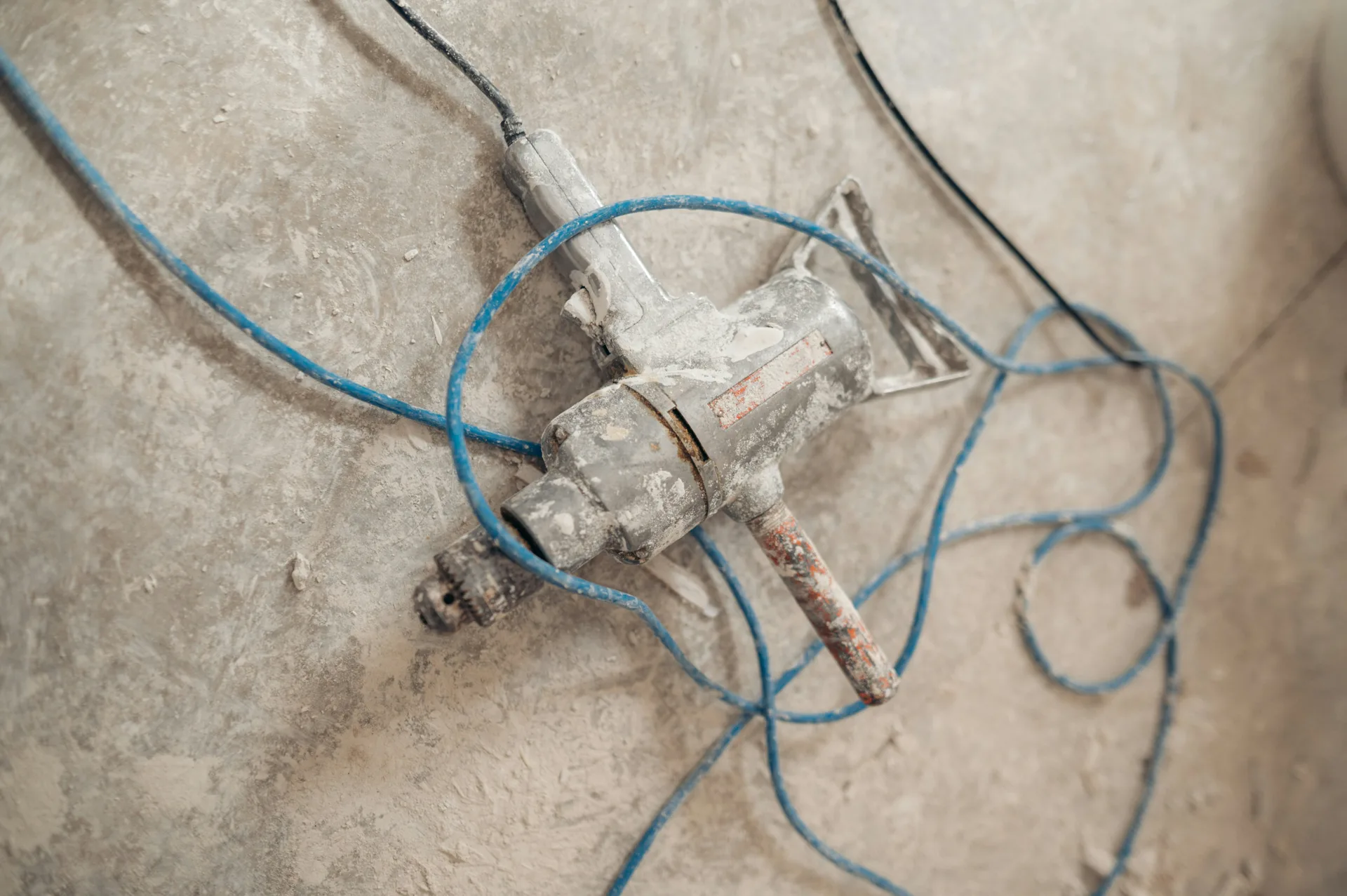 jackhammer removing a failed section of concrete for repair in Laval