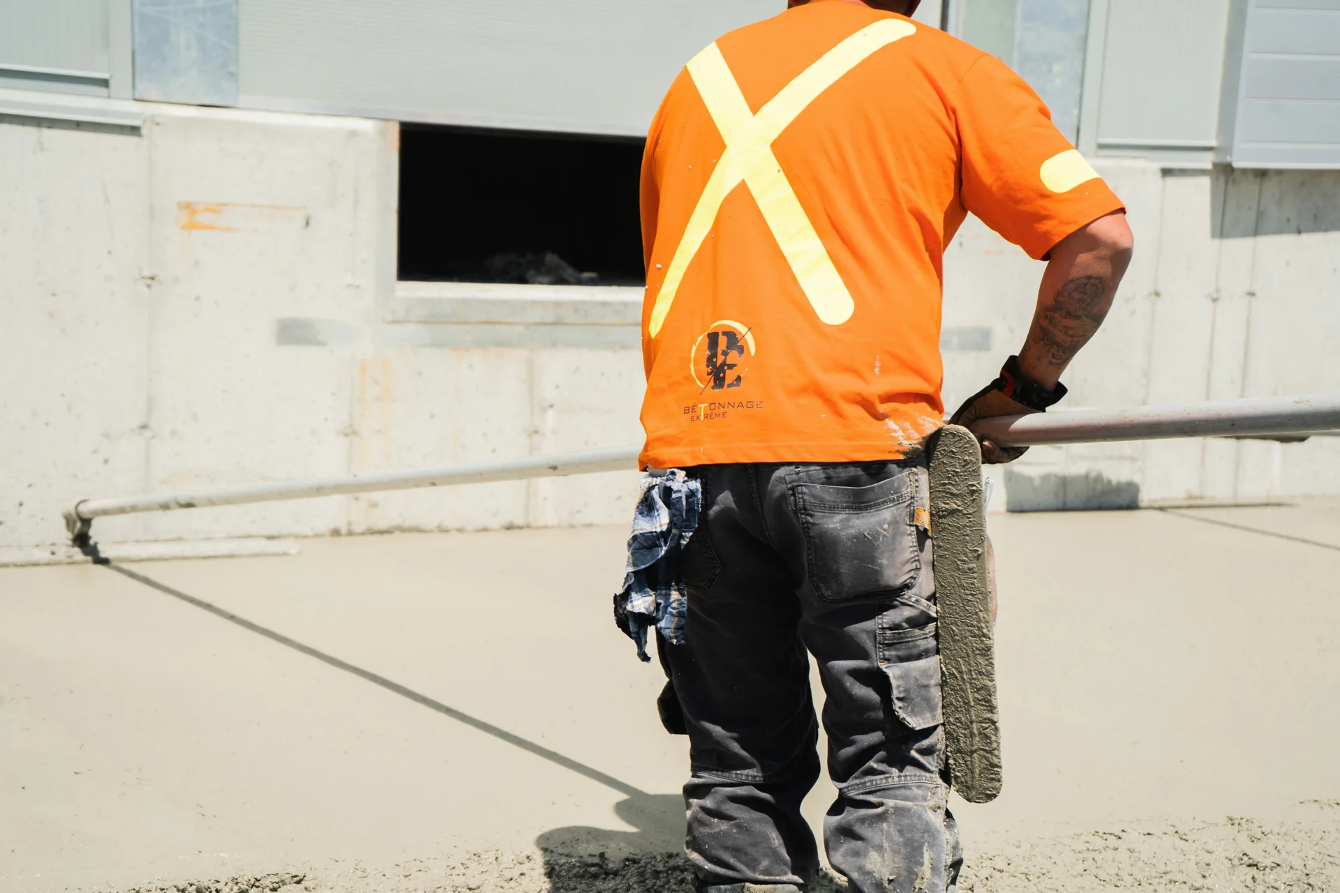 finisher working an Ardex application on a Laval floor