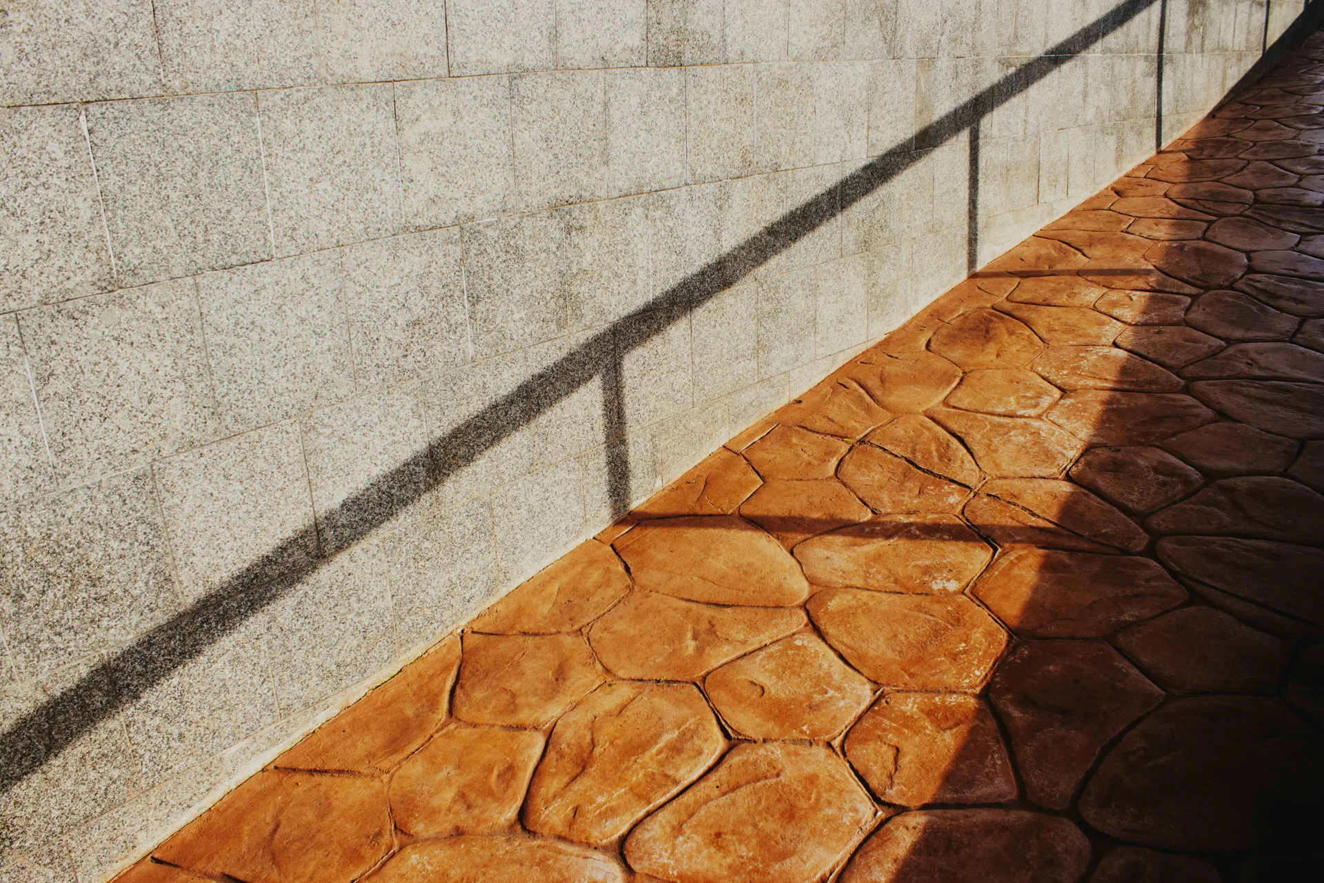 decorative stamped concrete flagstone walkway at a Laval home