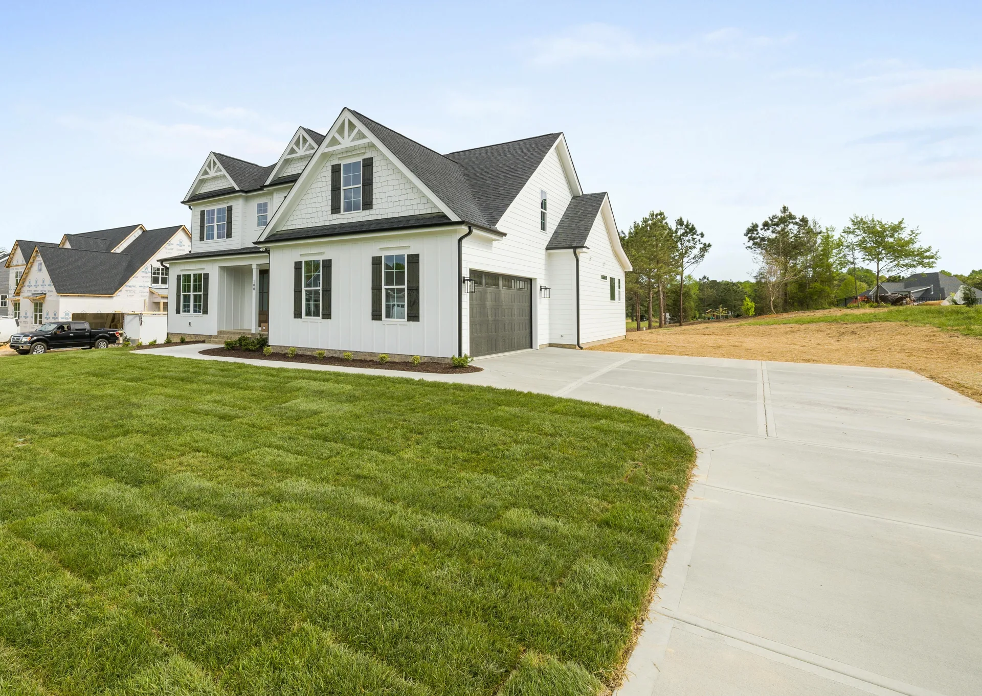 curving concrete driveway at an acreage home near Laval