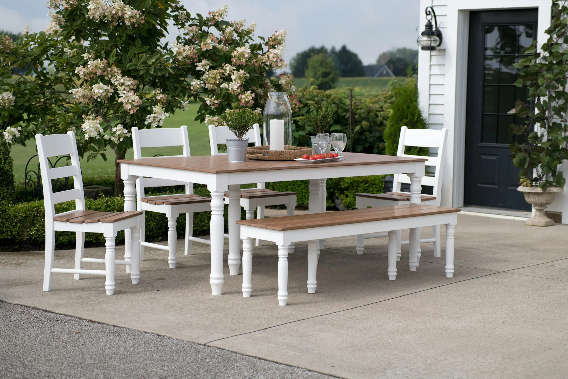 concrete patio with a dining table at a Laval farmhouse