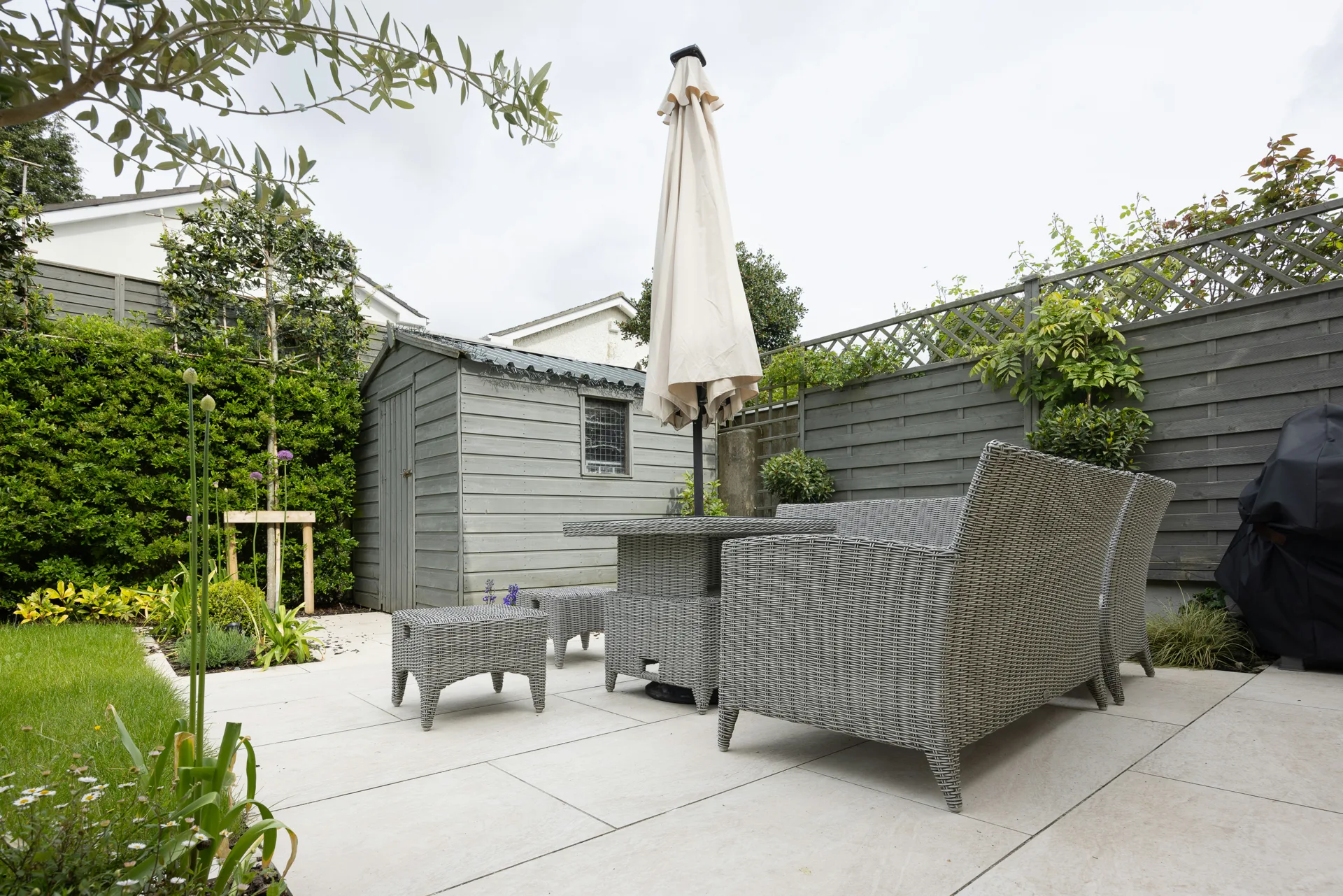 plain concrete patio in a Laval garden setting
