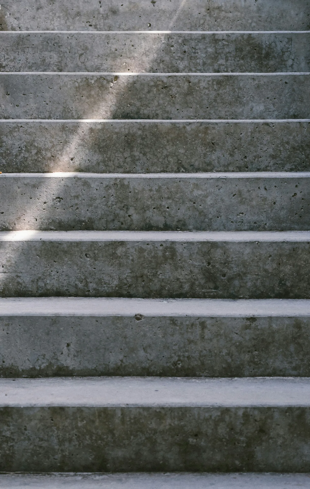 textured concrete entry steps at a Laval home