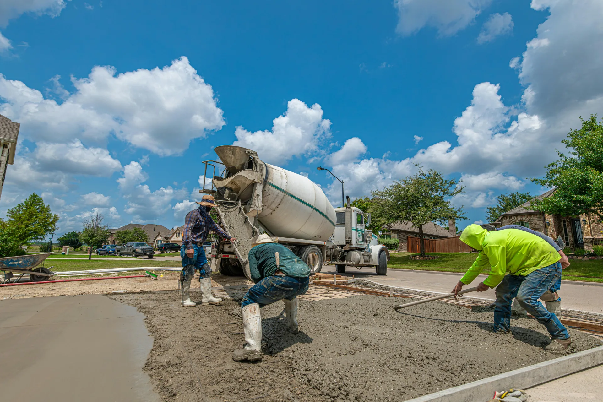 Laval Concrete crew finishing a fresh driveway pour