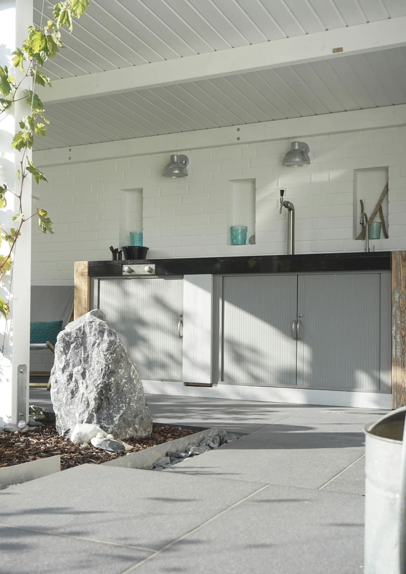 polished concrete outdoor bar counter at a Laval home