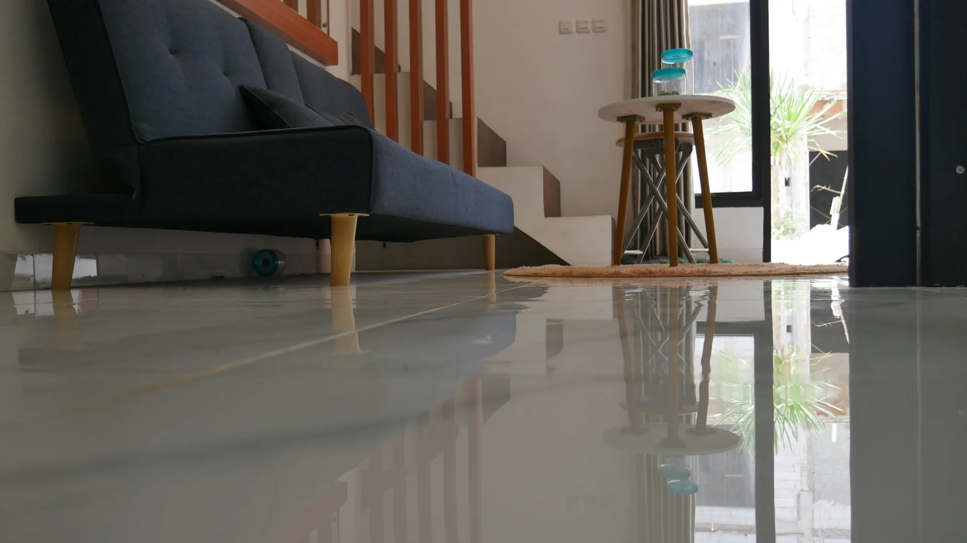 polished concrete floor reflecting light in a Laval living room